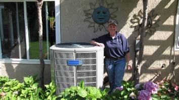 Kelly Mae standing next to an AC unit